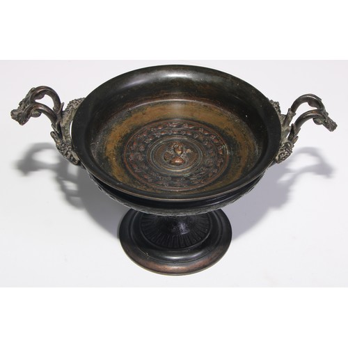 3025 - A 19th century French dark patinated bronze pedestal tazza, cast to the centre with a a relief bust,... 