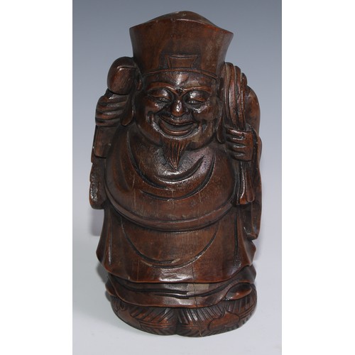 3074 - A Chinese bamboo carving, of Budai carrying a sack, 27.5cm high