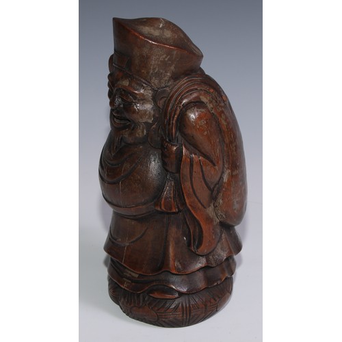 3074 - A Chinese bamboo carving, of Budai carrying a sack, 27.5cm high