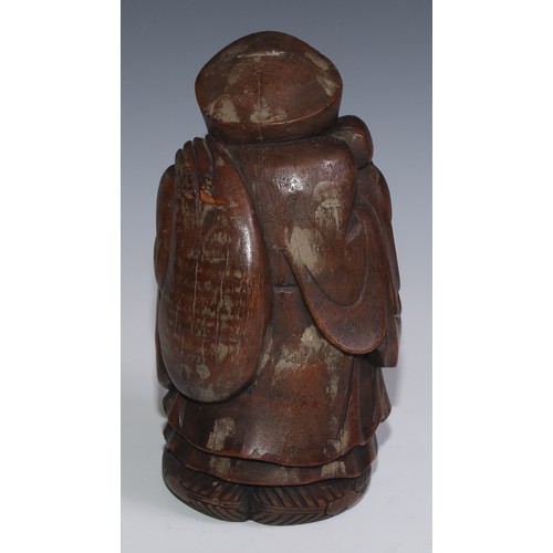 3074 - A Chinese bamboo carving, of Budai carrying a sack, 27.5cm high