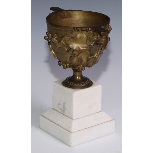 3029 - A 19th century gilt bronze krater shaped mantel urn, after the Antique, cast in relief with fruiting... 