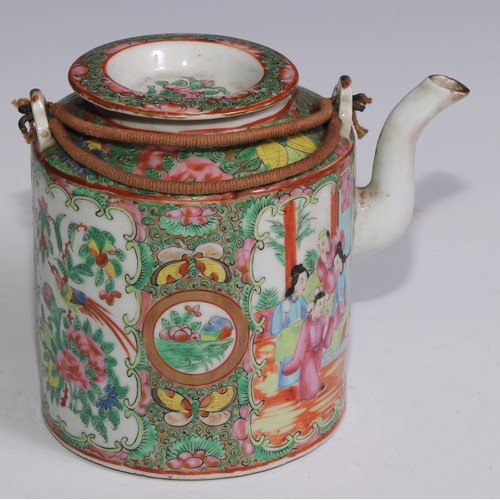 3071 - A Cantonese famille rose tea or wine pot, painted in polychrome enamels with Chinese figures, flower... 