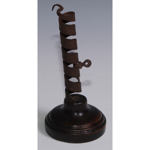 3049 - A 19th century iron spiral candlestick, fruitwood base, 20cm high