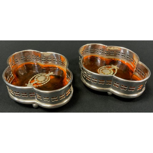 364 - A pair of Edwardian style quarter lobed, faux tortoise shell, bottle coasters (2)