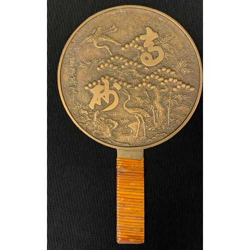 368 - A Japanese bronze Geisha hand mirror, cast with Cranes and blossoming branches,  character script, 1... 