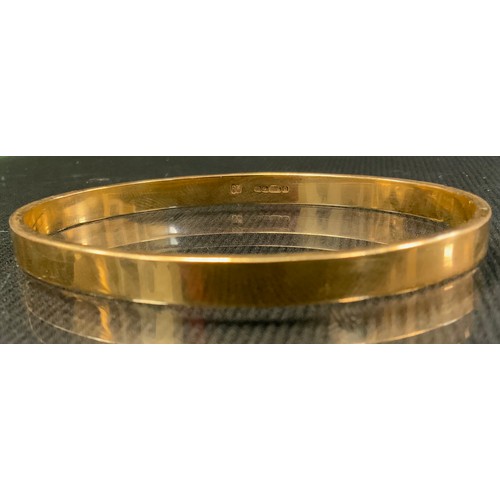 415 - A 9ct gold bangle, Sheffield 1978, 31.1g