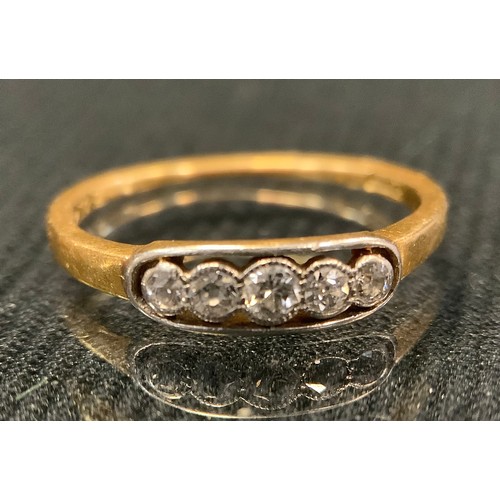 426 - A diamond line ring, set with five old brilliant cut diamonds, total estimated diamond weight approx... 