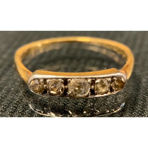 427 - A diamond line ring, set with five old brilliant cut diamonds, total estimated diamond weight approx... 