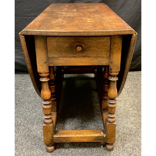 68A - A late 19th century oak gate-leg dining table, 75cm high x 123cm x 52.5cm (172.5cm with leaves exten... 