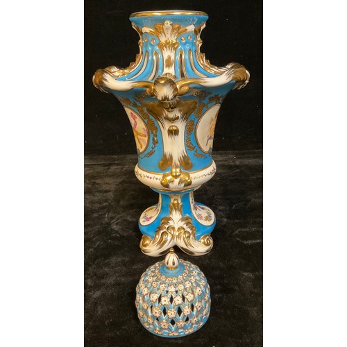 8 - A Continental porcelain vase and cover, decorated with putti, blue ground picked out in gilt decorat... 