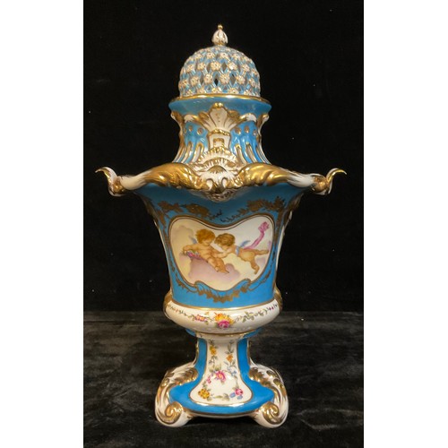 8 - A Continental porcelain vase and cover, decorated with putti, blue ground picked out in gilt decorat... 