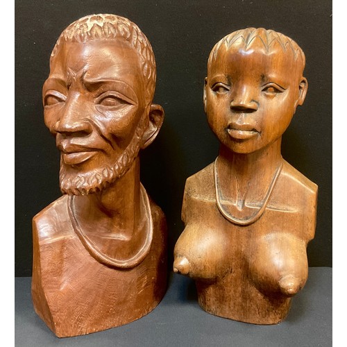 355A - A pair of African style carved hardwood busts, a man and a woman, 44cm high, and 42cm high respectiv... 