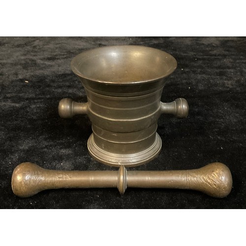 82 - A bronze pestle and mortar