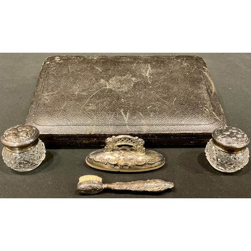 154 - A part silver manicure set; two cherub topped jars; a buffer and brushes