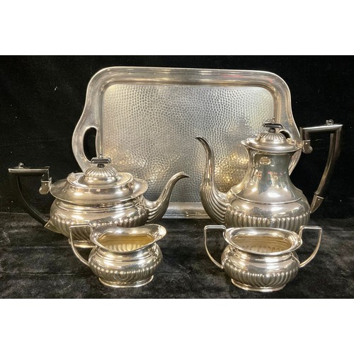 157 - A silver plated four piece boat shaped tea service, on a planished pewter two handled tray (5)