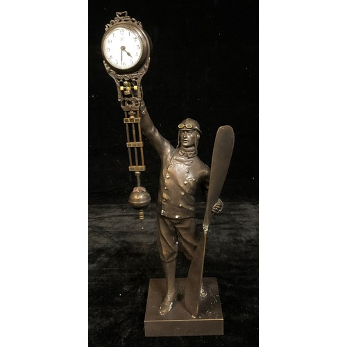 164 - A bronzed metal mystery clock modelled as an aviator, approx. 38cm high