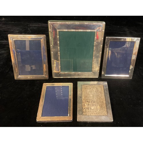 165 - A silver rectangular photograph frame, with inscription, 24cm x 19.5cm, London 1999; other silver ph... 