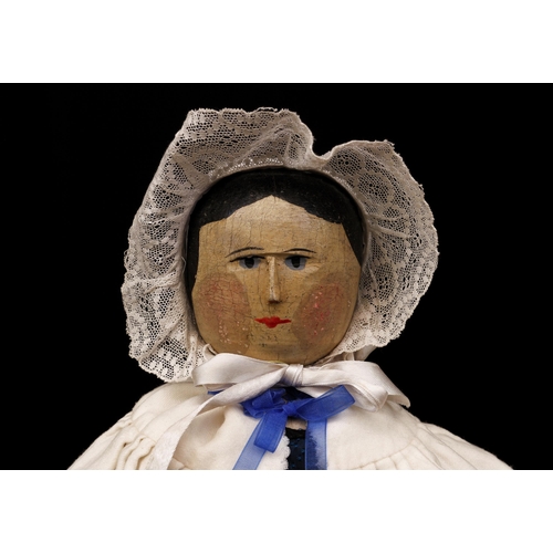 2003 - A mid 19th century Grödnertal or 'Dutch' peg doll, the carved and painted head with painted features... 