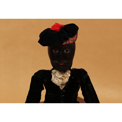 2015 - Folk Art - an early 20th century carved wooden and painted black doll, the carved and painted wooden... 