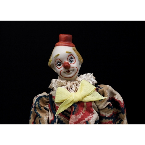 2037 - An early 20th century bisque shoulder head doll, in the form of a novelty Clown, of small proportion... 