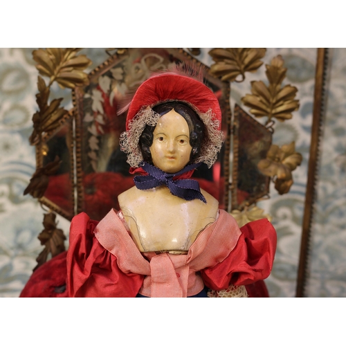 2059 - A mid 19th century painted papier-mâché shoulder head doll, the papier-mâché head with black moulded... 