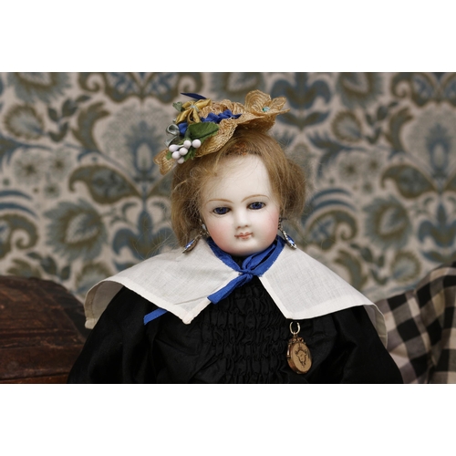 2127 - A 19th century pale bisque shoulder and bisque head French Poupée de Mode or fashion doll, the bisqu... 