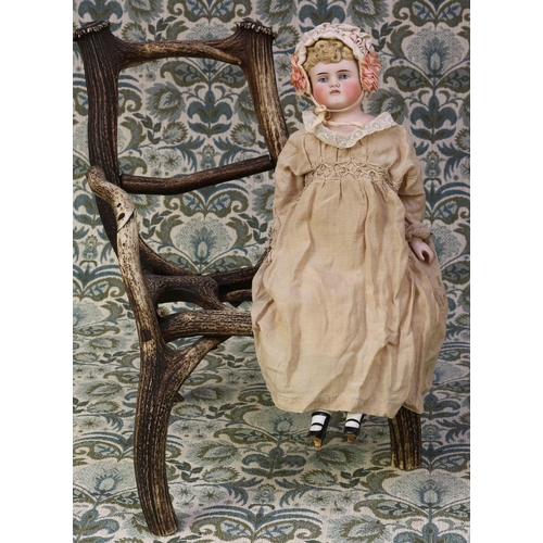 A 19th century bisque shoulder head doll, the bisque head wi...