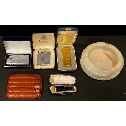 551 - A Dunhill Rollagas cigarette lighter, with instructions, cased; other lighters; a leather cigar case... 