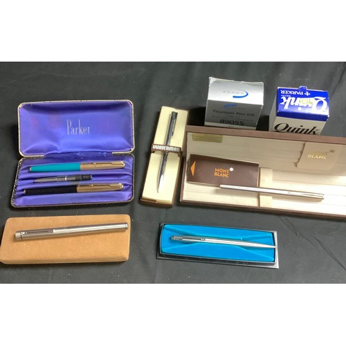 553 - A Mont Blanc fountain pen, 14ct gold nib, marked 585, boxed; a Waterman ballpoint pen, boxed; Parker... 