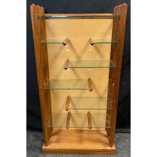 40 - A modern walnut and glass adjustable shelving unit, 141cm high x 74cm wide x 31cm deep;  a 1950’s mo... 