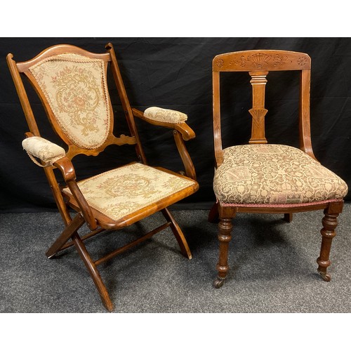 69 - A late Victorian mahogany folding campaign chair, shield-shaped back, upholstered back, arms, and se... 