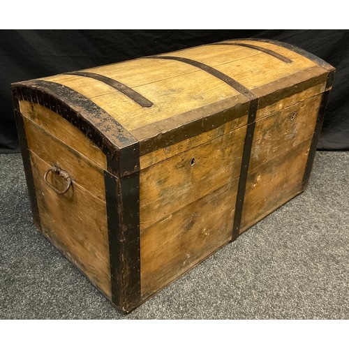 70 - An early 20th century pine dome-top chest, iron strap-work, carrying handles to sides, 54cm high x 9... 