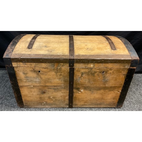 70 - An early 20th century pine dome-top chest, iron strap-work, carrying handles to sides, 54cm high x 9... 