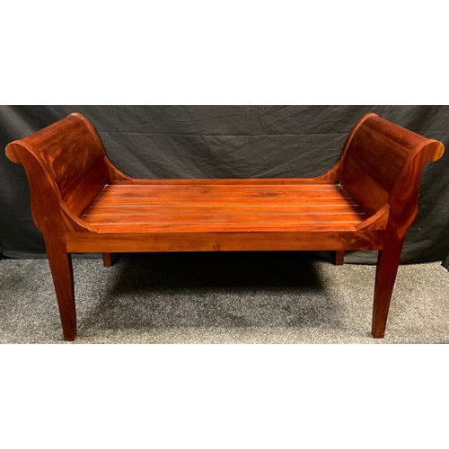 80 - A contemporary mahogany sleigh bench / window seat, 69.5cm high x 127cm wide x 50.5cm deep.