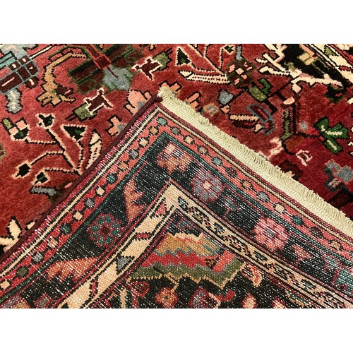 84 - A North-West Persian Malayer runner carpet / rug, hand-knotted in tones of deep red, cream, and indi... 