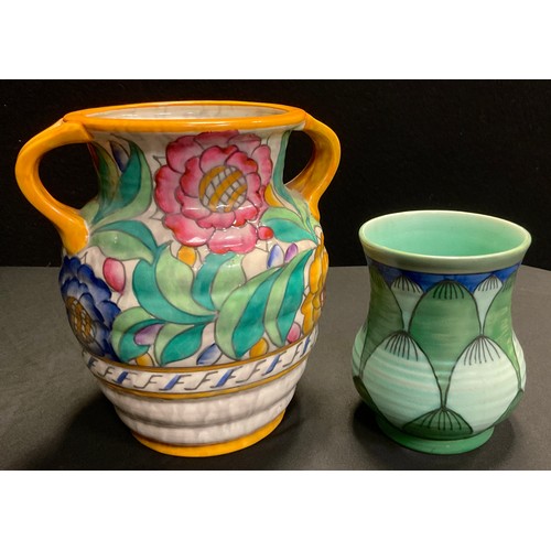 89 - A Charlotte Rhead Crown Ducal pottery twin handled vase, tube-lined in the Persian Rose pattern,20cm... 