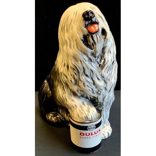 94 - A large Beswick Dulux advertising model of an Old English Sheep dog, with paw stood upon a tin of pa... 