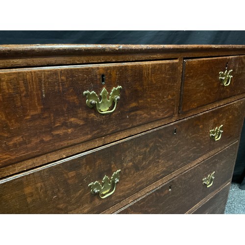 106 - A George III oak chest, two short over three long graduated drawers, brass swan-neck handles, bracke... 