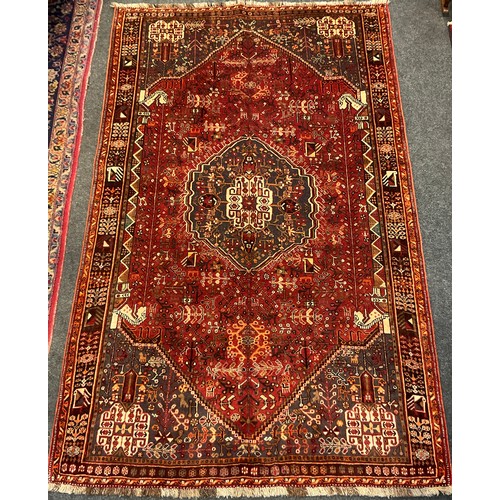 115 - A South-West Persian Qashgai rug / carpet, hand-knotted with a hexagonal medallion with an intricate... 