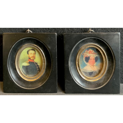 118 - A reproduction pair of black framed miniatures of Gentleman and lady companion, each 11cm x 10cm (2)