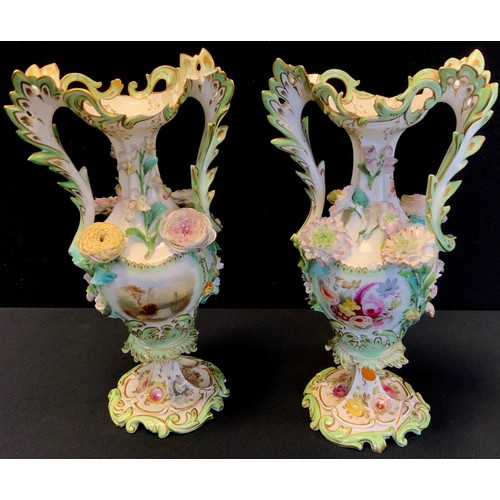 160 - A pair of 19th century Coalbrookdale porcelain twin handled vase, painted with landscape and floral ... 