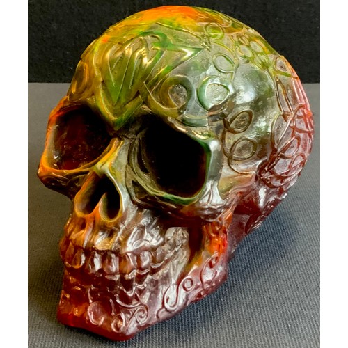 196 - A multi-tone gothic style Amber effect resin model skull