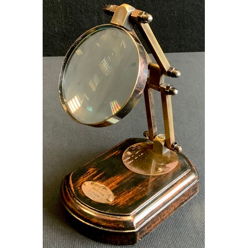 207 - A two point adjustable magnifying glass on wooden stand,13cm long