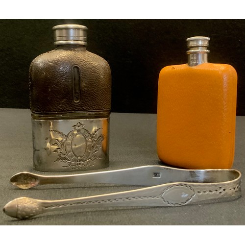 443 - A pair of George III silver sugar bows, Possibly Robert Ellis, London;  two hip flasks (3)