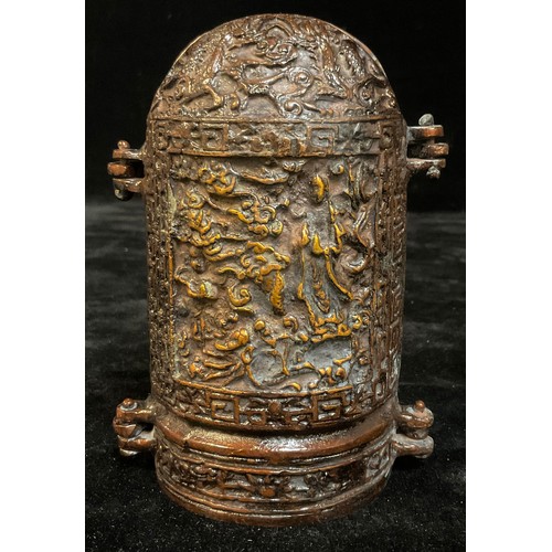 936 - Asian Art - a bronzed metal shrine or altar piece triptych, enclosing three figures, 14cm high