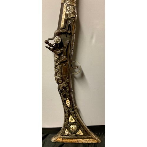 1300 - An Afghan flintlock jezail, silver coloured metal and bone mounted, 134cm long