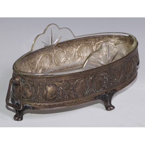 1302 - An Art Nouveau table jardiniere, in the manner of WMF, embossed in relief with stylised fruiting and... 