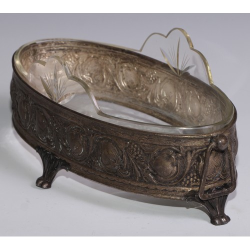 1302 - An Art Nouveau table jardiniere, in the manner of WMF, embossed in relief with stylised fruiting and... 