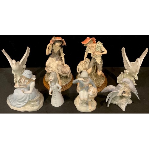 A pair of Italian Giuseppe Armani resin figures, The Shepherd and The  Shepherdess, stepped wooden ba