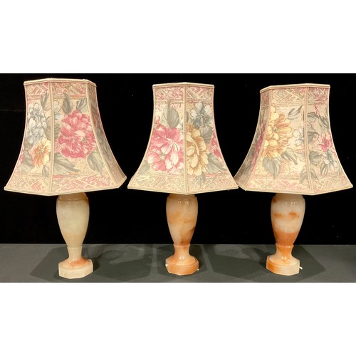 1426 - Interior Decoration - a set of three alabaster slender ovoid table lamps; a brass five branch electr... 